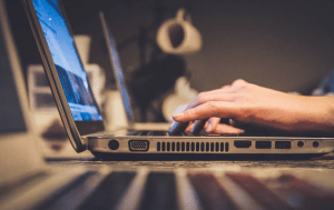 man sitting in front of his computer