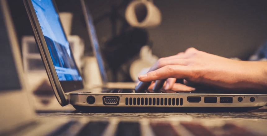 man sitting in front of his computer